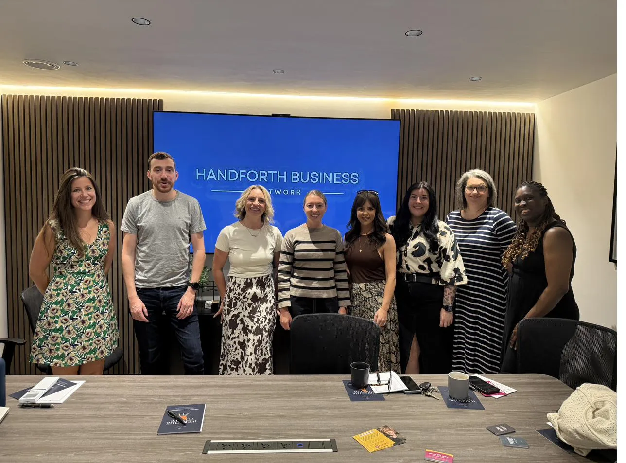 Group photo of network members in Mary D's meeting room
